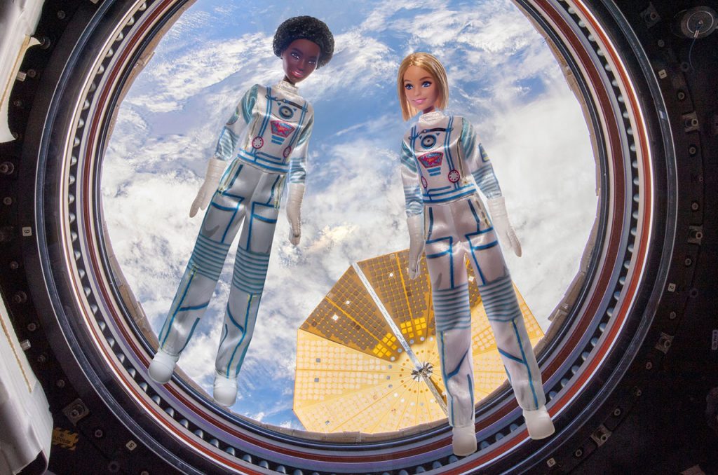 Trading dress-up for lift-off, Barbie flies on space station for first time