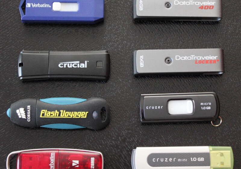 How much storage did the first USB flash drive provide?