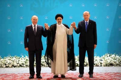 Russian President Vladimir Putin travels to Iran to meet with Iranian, Turkish leaders