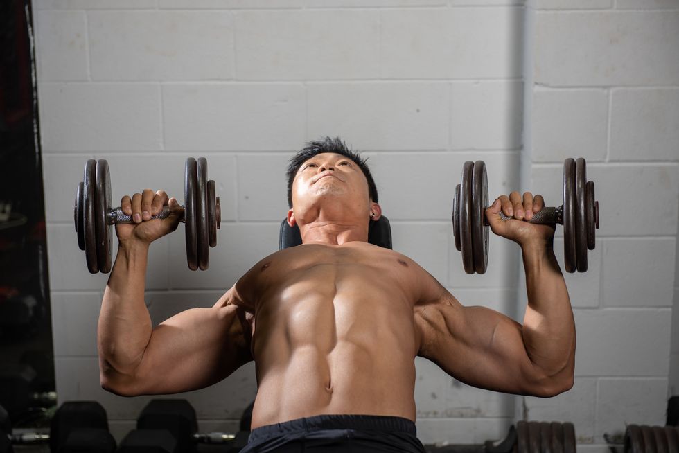 A Top Trainer Shared 5 Common Dumbbell Bench Press Mistakes, and How to Fix Them