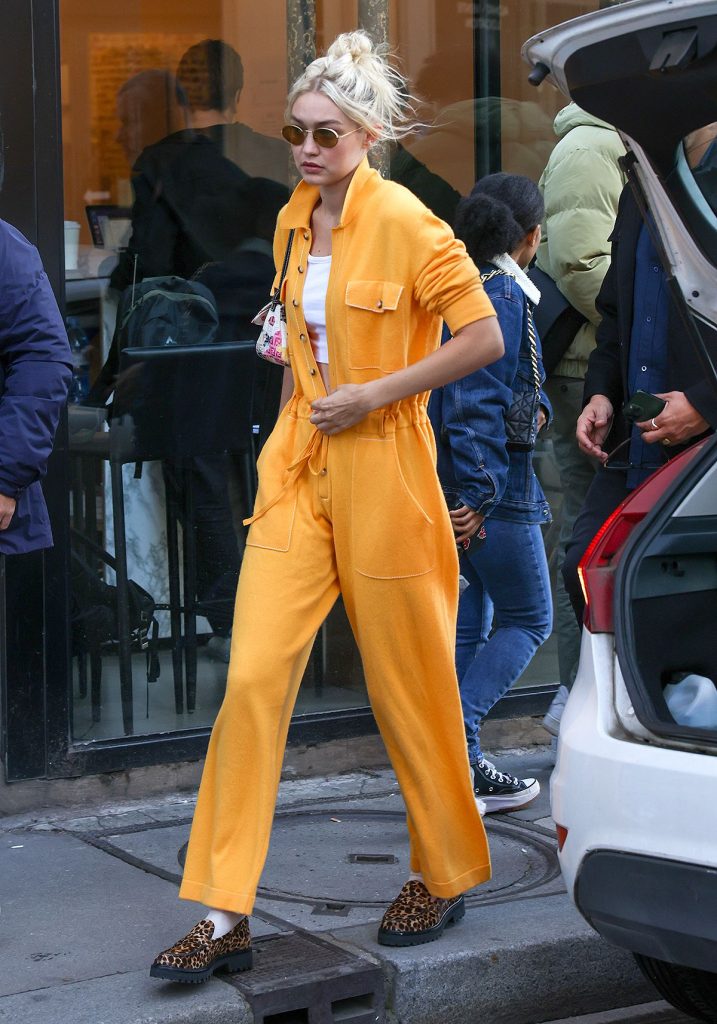 Gigi Hadid Strolled Through Paris Wearing a Cozy Orange Jumpsuit and Printed Loafers That Are Both Bold and Neutral