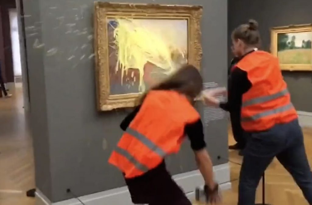Climate Protesters Throw Mashed Potatoes At Monet Painting