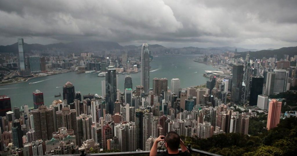 Cyclone, absences threaten to dull Hong Kong finance meeting