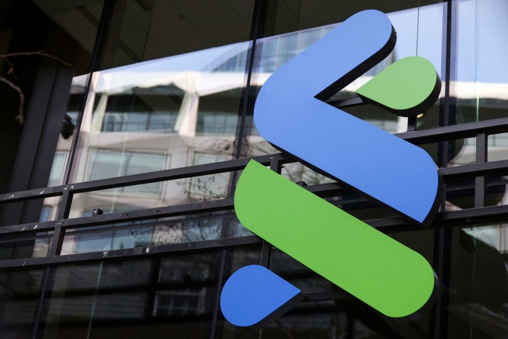 First Abu Dhabi Bank Is Said to Explore Standard Chartered Bid