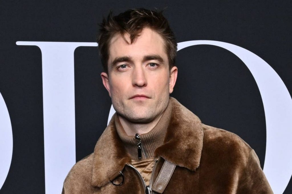 Robert Pattinson Wore A Skirt And A Brown Fleece To Paris Fashion Week, And It Sure Is Something