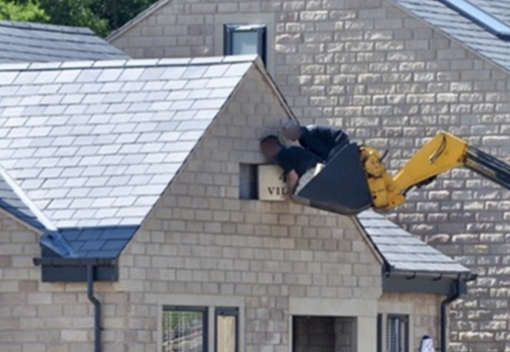 Firm fined £120,000 for lifting two builders in a telehandler bucket