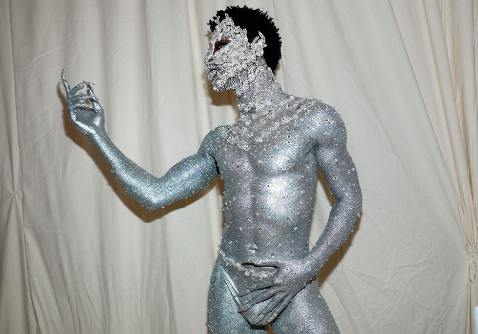 Lil Nas X Showed Up to the Met Gala in Nothing But a Metallic Thong, Silver Body Paint, and Jewels